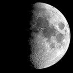 The Moon is shown with its right half lit up.