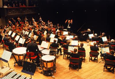 a large orchestra performing on stage