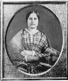 an old photograph of a young woman