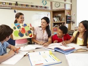 children working with their teacher