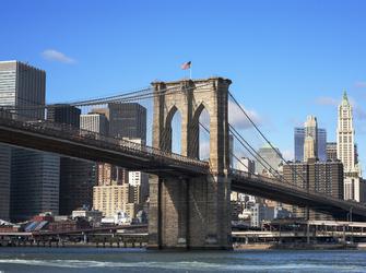 a large, stone bridge in a big city
